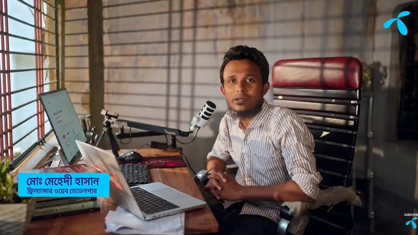 Md Mahedi Hasan, founder of PixelFly, at his desk in Jashore, in Grameenphone's documentary